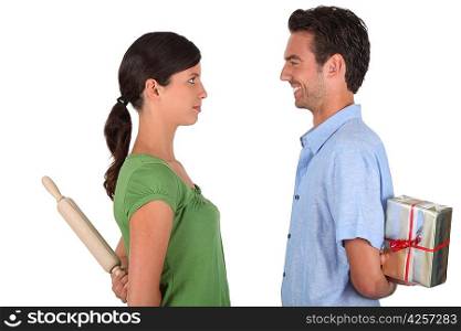 Man apologizing to woman with rolling-ping