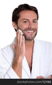 man applying shaving cream