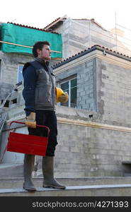 Man arriving at building site