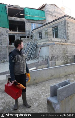 Man arriving at building site