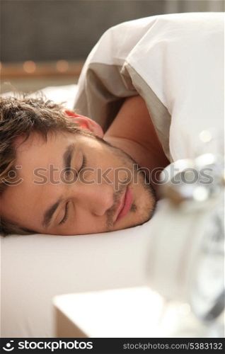Man asleep in bed