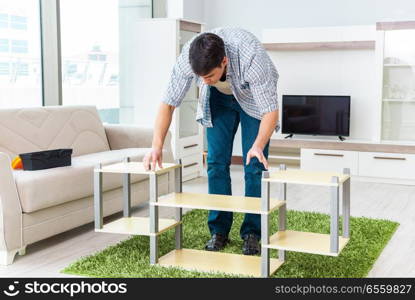 Man assembling furniture at home