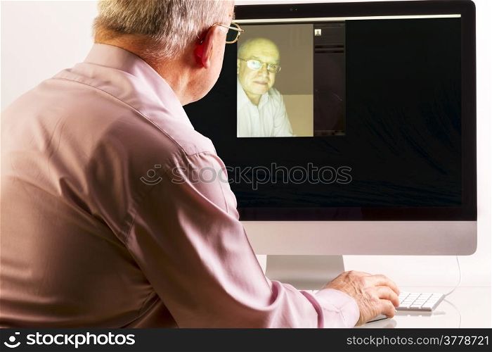 Man at computer on white background