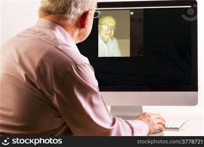 Man at computer on white background