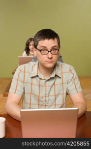 Man at Head of Row of Laptop Users