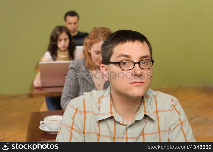 Man at Head of Row of Laptop Users