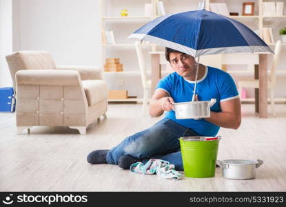 Man at home dealing with neighbor flood leak