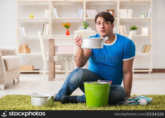 Man at home dealing with neighbor flood leak