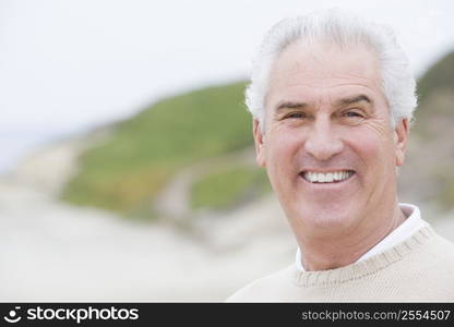 Man at the beach smiling