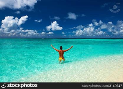 Man at tropical beach at Maldives