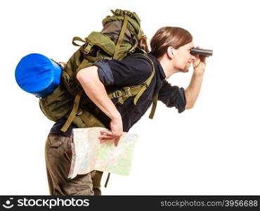 Man backpacker with map looking through binoculars. Man tourist backpacker holding map looking through binoculars. Young guy hiker backpacking. Summer vacation travel. Isolated on white background.