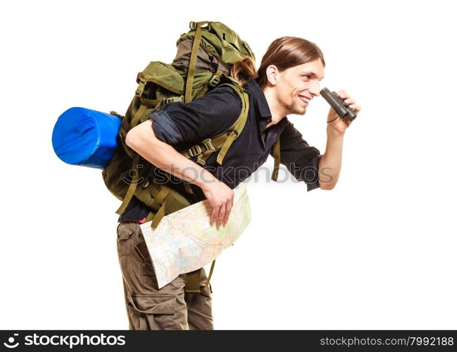 Man backpacker with map looking through binoculars. Man tourist backpacker holding map looking through binoculars. Young guy hiker backpacking. Summer vacation travel. Isolated on white background.