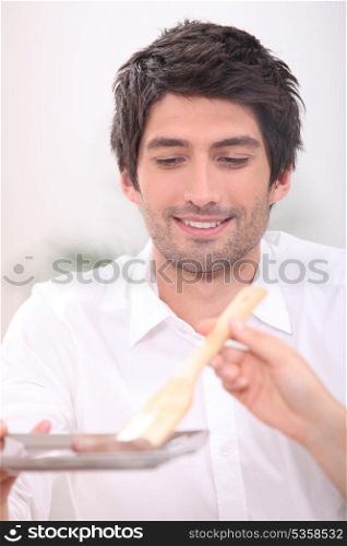 Man being served food