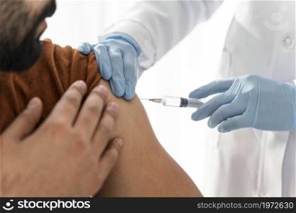 man being vaccinating by doctor close up. High resolution photo. man being vaccinating by doctor close up. High quality photo