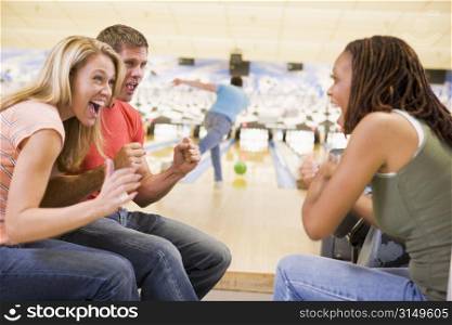 Man bowling with friends