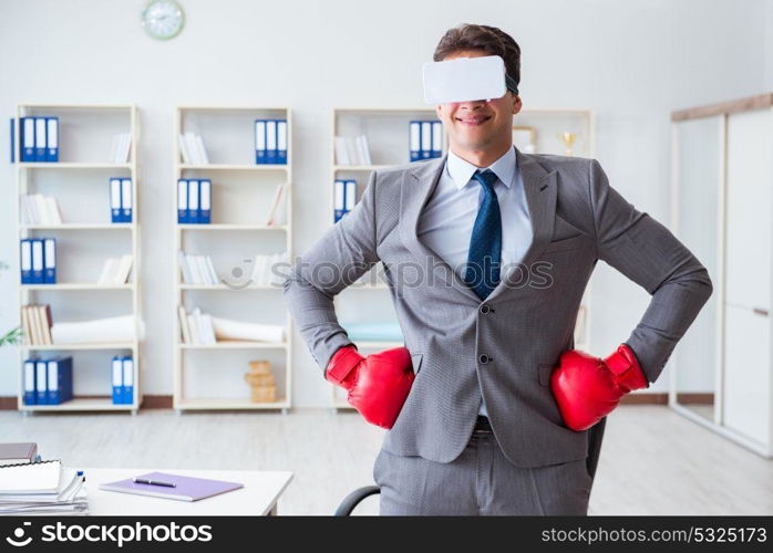 Man boxing in the office with virtual reality goggles