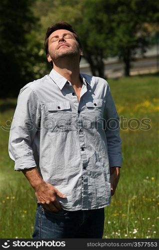 Man breathing in fresh air