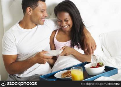 Man Bringing Woman Breakfast In Bed On Celebration Day