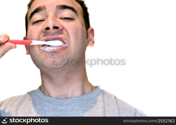 Man brushing his teeth with red toothbrush