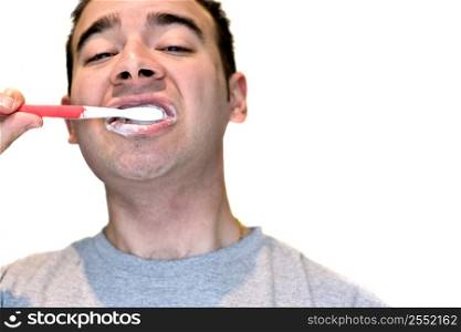 Man brushing his teeth with red toothbrush