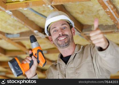 man builder showing thumb up to the camera