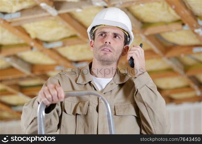 man builder using a walkie talkie