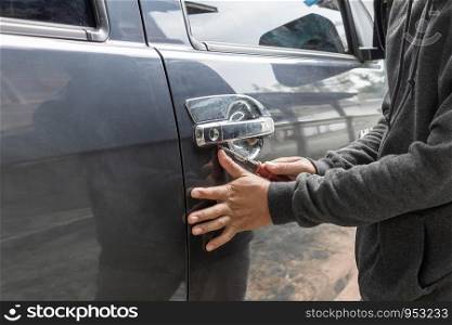 Man burglar stealing car security