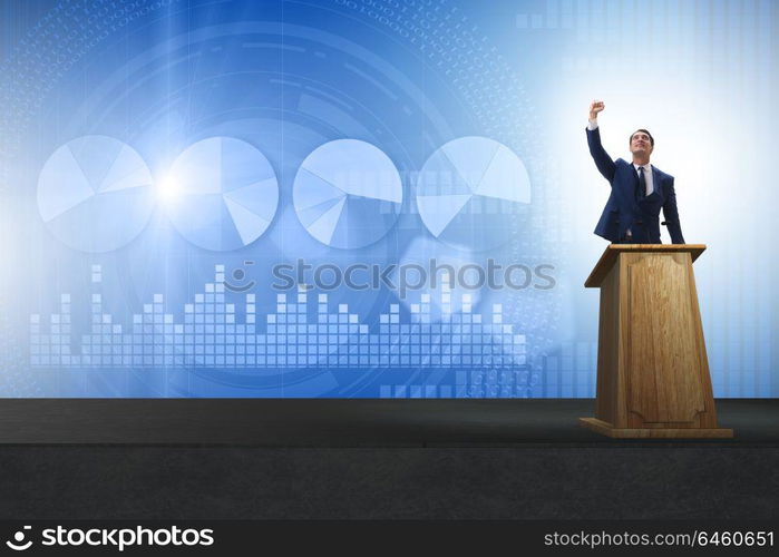 Man businessman making speech at rostrum in business concept