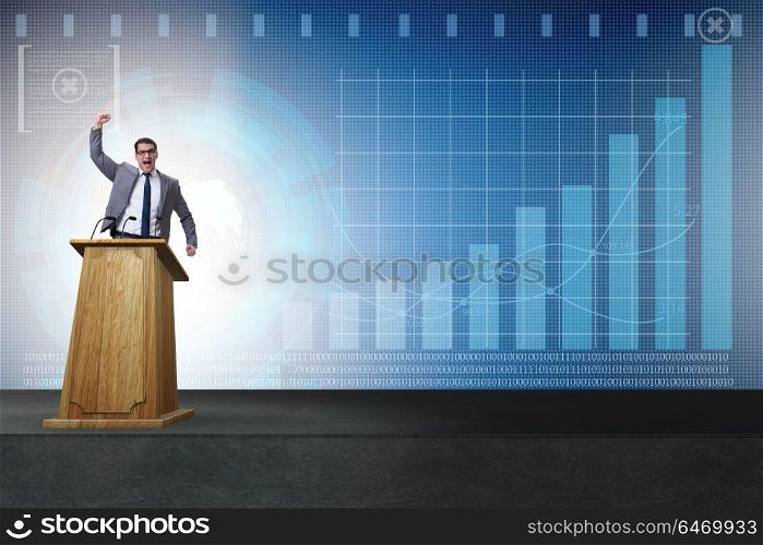 Man businessman making speech at rostrum in business concept