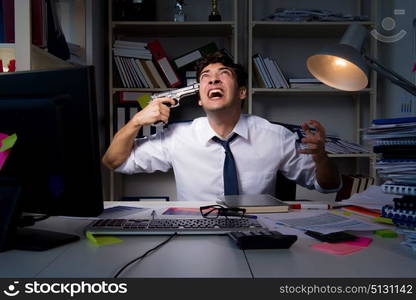 Man businessman working late hours in the office