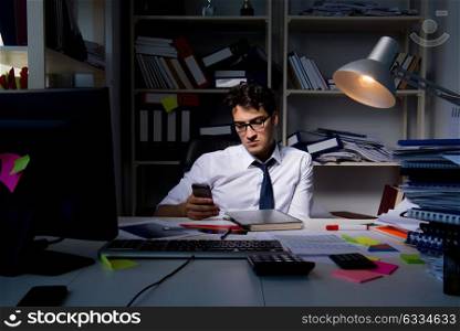 Man businessman working late hours in the office
