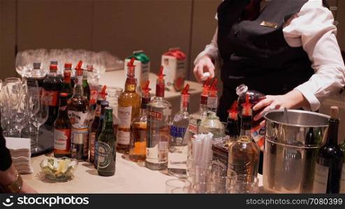 Man buys drink at a conference