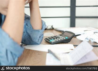 man calculate domestic bills. Businessman with calculator checking balance & costs. Startup counting finance for paying taxes at office