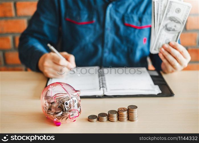Man calculator Accounting Calculating with Piggy bank money stack step growing saving money