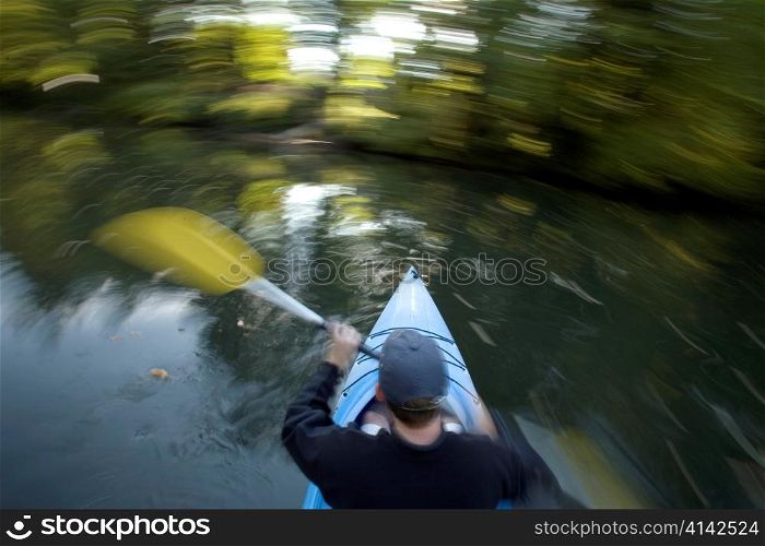 Man Canoeing in Whirling Motion