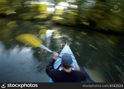 Man Canoeing in Whirling Motion