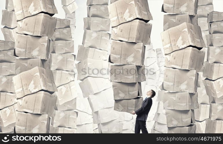 Man carry carton boxes. Businessman carrying big stack of carton boxes