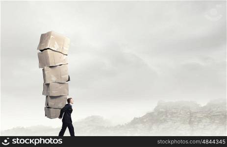 Man carry carton boxes. Businessman carrying big stack of carton boxes