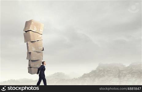 Man carry carton boxes. Businessman carrying big stack of carton boxes