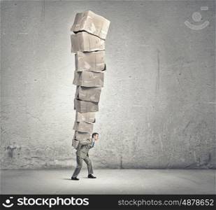 Man carry carton boxes. Young businessman in suit carrying big stack of carton boxes