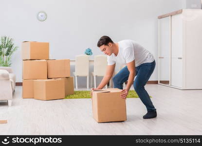 Man carrying boxes at home