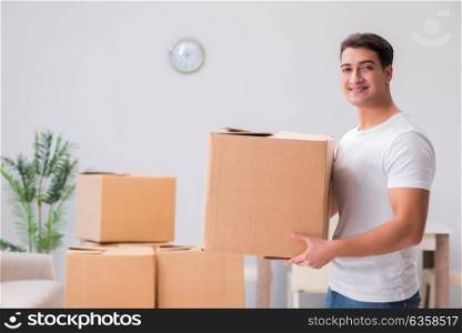 Man carrying boxes at home