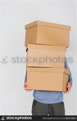 Man carrying cardboard boxes
