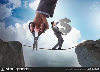Man carrying dollar on tightrop