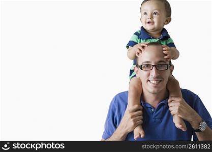 Man carrying his son on his shoulders