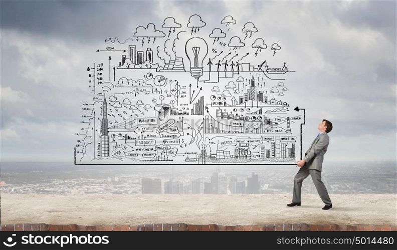 Man carrying ideas. Young businessman carrying his great business plan in hands