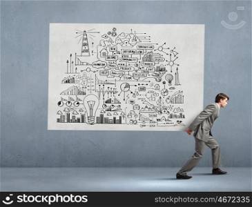 Man carrying ideas. Young businessman carrying his great business plan on back
