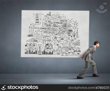 Man carrying ideas. Young businessman carrying his great business plan on back