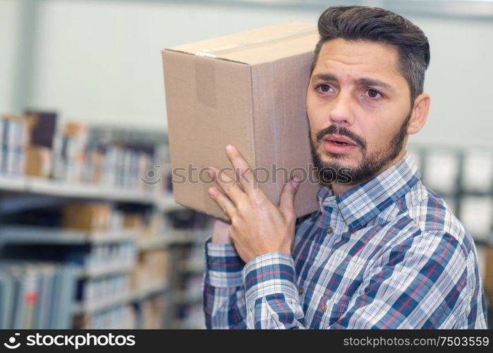 man carrying package for delivery