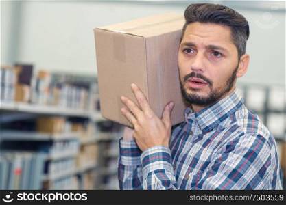 man carrying package for delivery